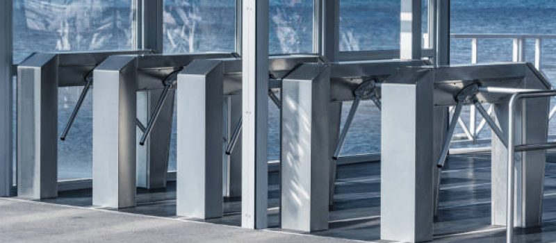 Turnstiles with electronic card readers on the sea port territory. Turnstiles with electronic card readers on the sea port territory.